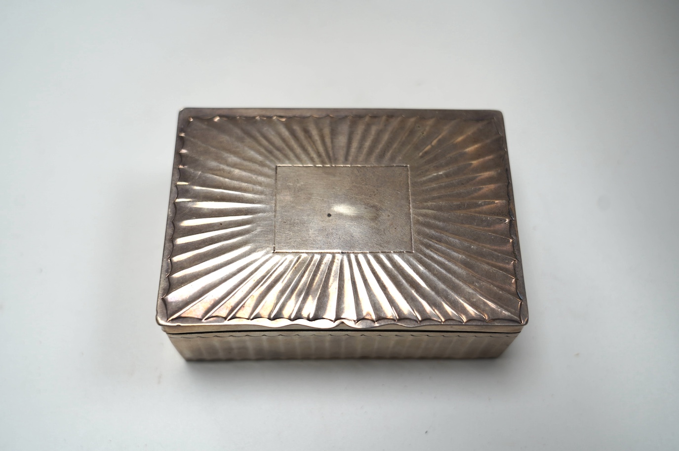 A white metal cigarette box, 11.6cm, 7.4oz. Condition - poor